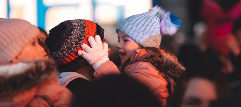 Child embracing father at Southampton's Countdown to Christmas event